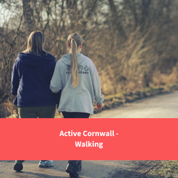 2 women walking down a path, text reads "active cornwall - walking"