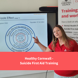 Healthy cornwall team member delivering training, text reads "Healthy Cornwall - Suicide First Aid Training"