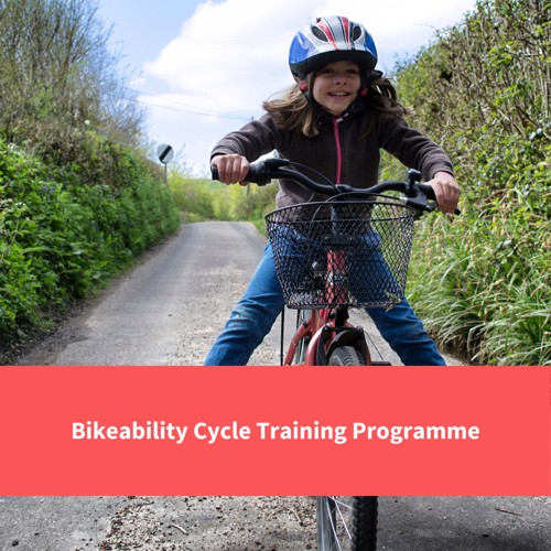 boy riding bike, text reads "bikeability cycle training programme"