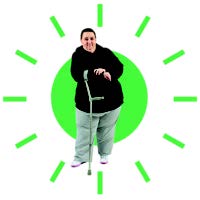 a person stood with their crutch and a green sun shining behind them