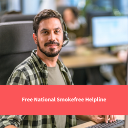 man working in a call centre smiling at camera, text reads "free national smokefree helpline"