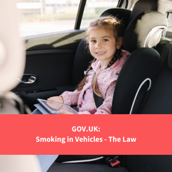 a girl sat in a child seat in a car smiling, text reads "gov.uk: smoking in vehicles - the law"