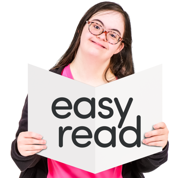 person holding an easy read sign