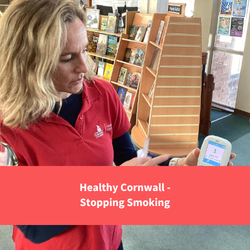 healthy cornwall staff member holding co2 breath test, text reads "healthy cornwall - stopping smoking"