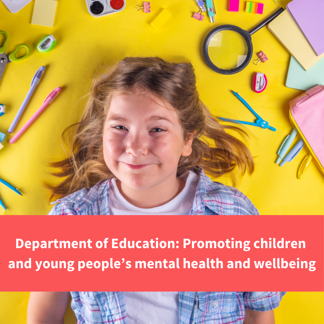 young girl smiling whilst lying on floor with craft items, text reads "prmoting young peoples mental health and wellbeing"