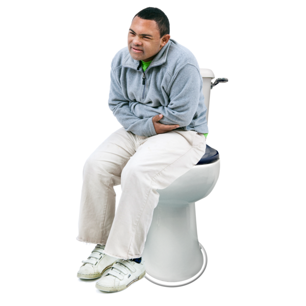 image of person sitting on toilet holding stomach