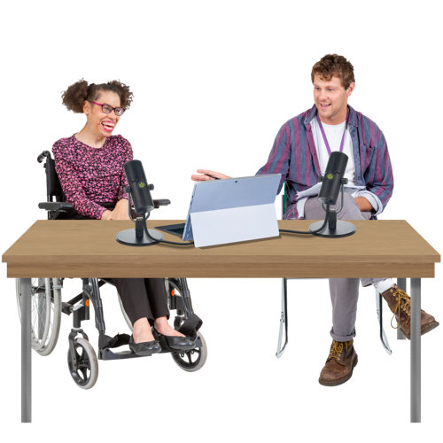 two people sat behind a desk recording a podcast